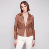 Woman wearing a brown leather jacket on a white background