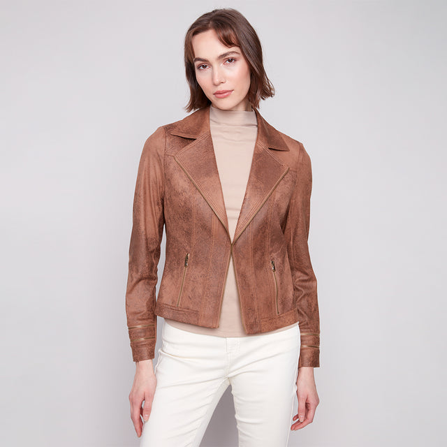Woman wearing a brown leather jacket on a white background