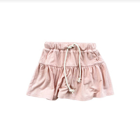 A blush pink skort with a drawstring waist for girls.