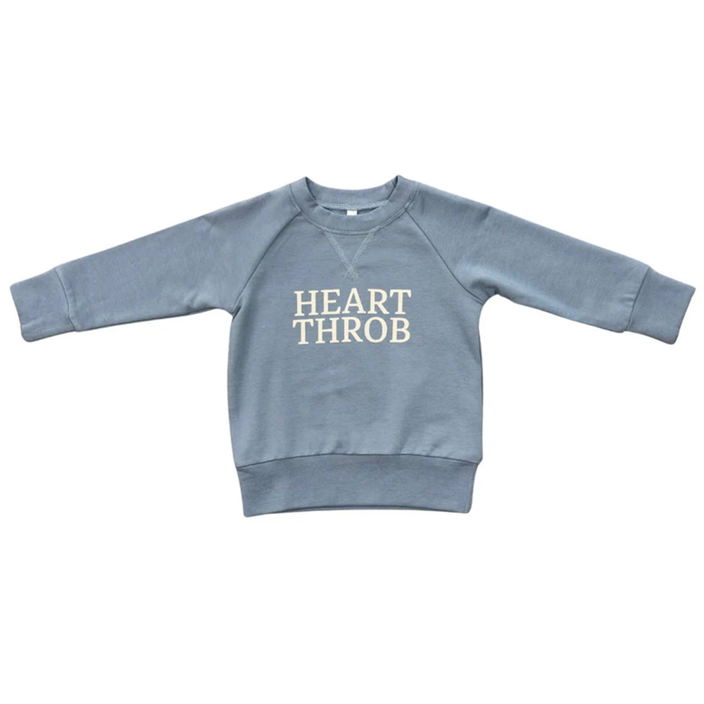 Blue sweatshirt with 'HEART THROB' text on a white background
