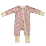 Pink baby onesie with floral pattern and yellow zipper on a white background