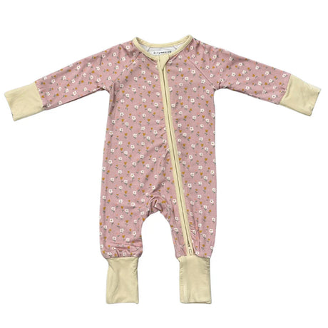 Pink baby onesie with floral pattern and yellow zipper on a white background