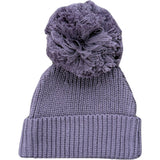 Knitted beanie with a large pom-pom on a white background