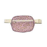 A small waist bag with a dusty purple leopard print pattern and cream-colored straps and zipper, shown against a plain white background.