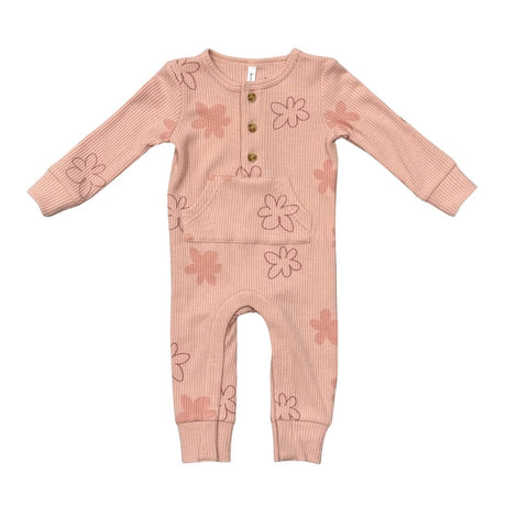 A baby's long-sleeve ribbed jumpsuit in a dusty pink color, decorated with a pattern of simple pink and brown flower outlines. It features a button-up front with three wooden buttons.