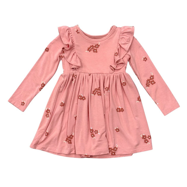 A pink long-sleeve dress for toddlers or girls, featuring ruffled shoulder details, a gathered waist, and small brown floral prints scattered across the fabric, shown against a plain white background.