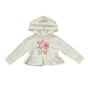 An off-white long-sleeve hooded sweatshirt for toddlers, featuring a ruffled hem and a colorful graphic on the front spelling 'Love' with a flower motif, displayed on a solid white background.