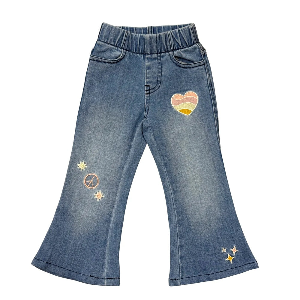 Blue denim pants with heart and star designs on a white background