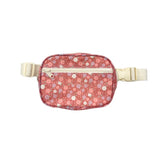 A small waist bag with a pink floral pattern and cream-colored straps and zipper, shown against a plain white background.