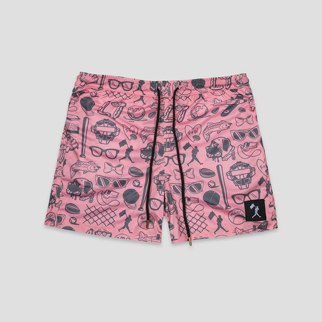 Pink shorts with a black graphic print of various icons like sunglasses, hats, and baseball bats, featuring a black drawstring and a small black brand patch on the lower left leg.