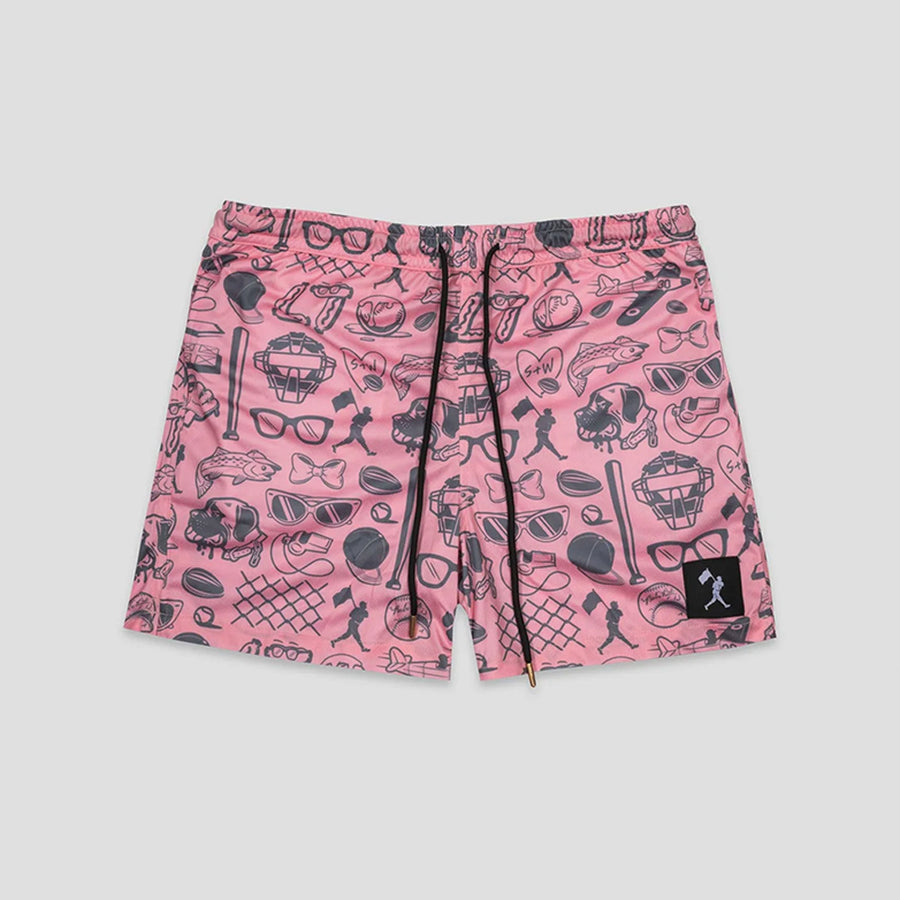 Pink shorts with a black graphic print of various icons like sunglasses, hats, and baseball bats, featuring a black drawstring and a small black brand patch on the lower left leg.