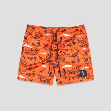 Bright orange shorts with an all-over black and white sketch-style print of dogs, clouds, and outdoor motifs, shown flat against a light gray background.