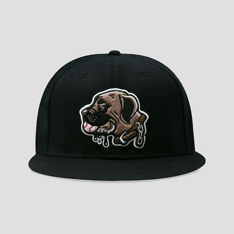 A black flat-brim snapback cap featuring a detailed embroidered patch of a brown dog with dripping white and red accents on the front, set against a solid light gray background.