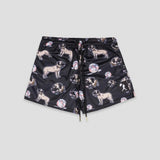 Black shorts featuring an all-over print of pug dogs and baseballs, with a black drawstring waist, shown flat on a light gray background.