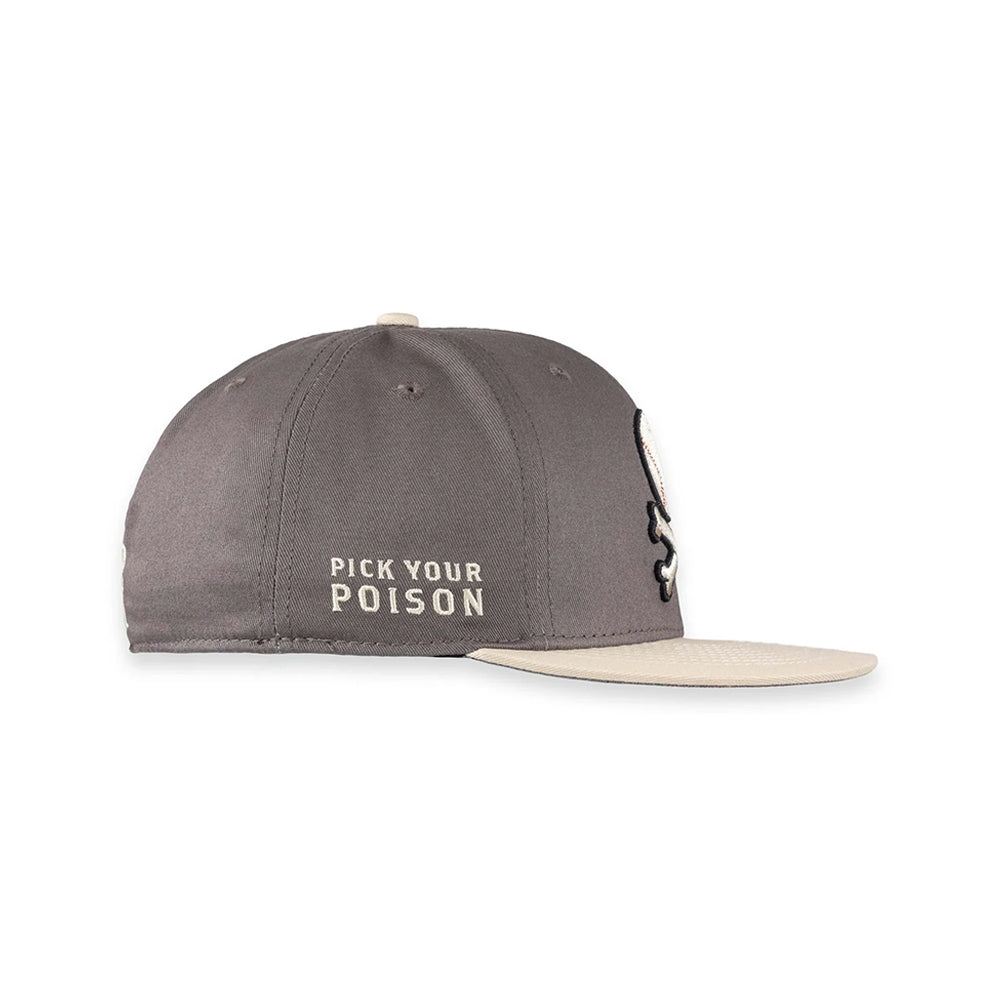 A dark gray snapback cap with a beige flat brim, featuring the embroidered text 'PICK YOUR POISON' on the front and a black-and-white skull graphic on the side.