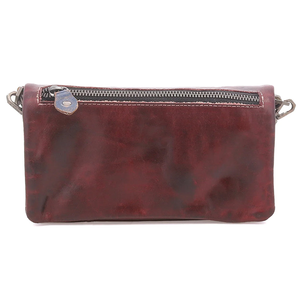 A distressed dark red leather clutch bag with a top zipper closure and a small silver metal snap button, shown against a plain white background.