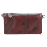 A distressed dark red leather clutch bag with a top zipper closure and a small silver metal snap button, shown against a plain white background.