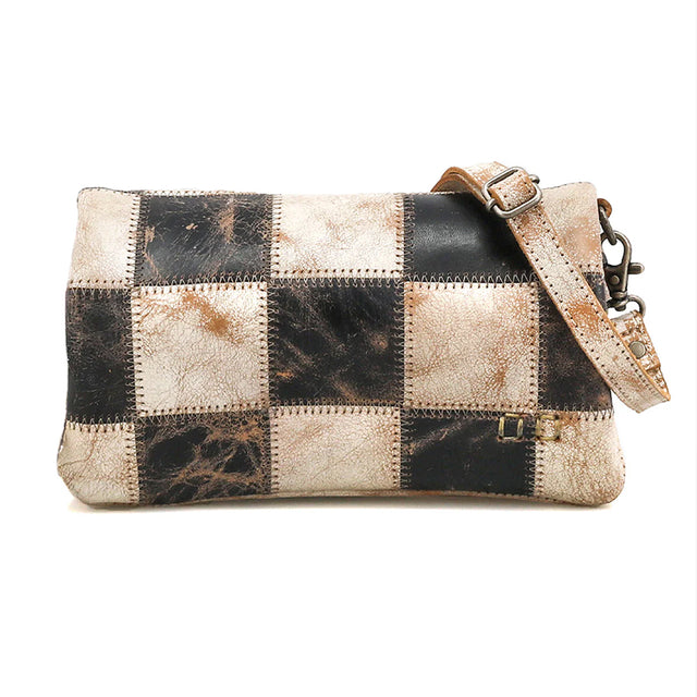 Patchwork leather handbag with a shoulder strap on a white background