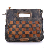 Handbag with woven pattern on a white background