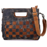 Handbag with woven pattern and brown strap on a white background