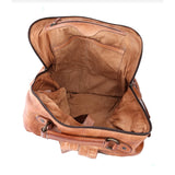 Brown leather suitcase open on a white background