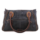 A black leather shoulder bag with dark brown leather handles, trim, and zipper details, featuring decorative stitching along the edges, shown against a plain white background.