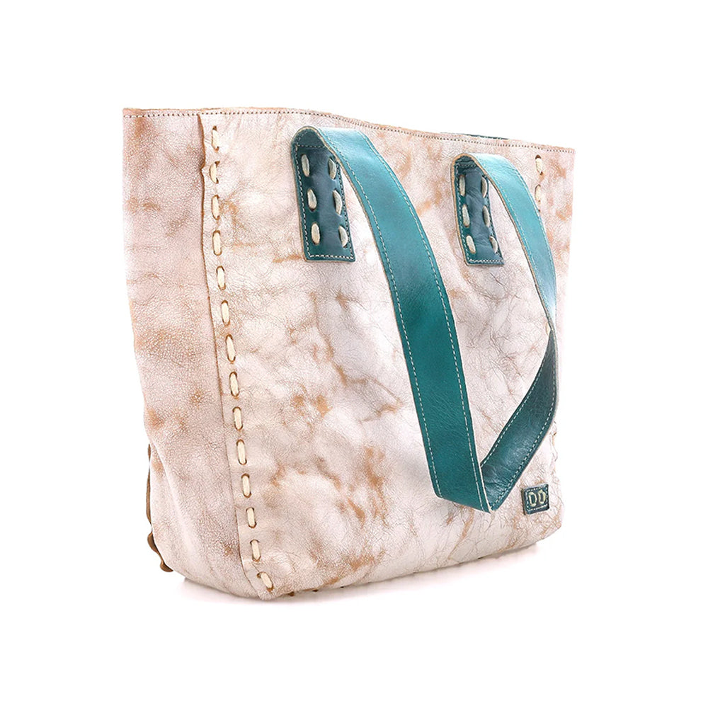 A large tote bag with a distressed beige and white marbled pattern, featuring prominent teal blue handles and decorative gold-toned stitching along the side.