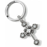 Silver cross keychain with decorative elements on a white background
