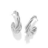 Pair of silver hoop earrings on a white background