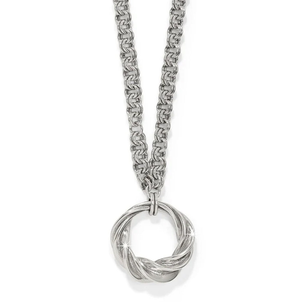 Silver necklace with a intricate pendant on a white background