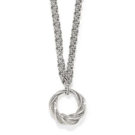 Silver necklace with a intricate pendant on a white background