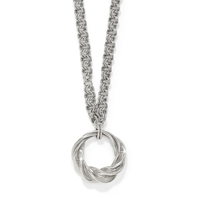 Silver necklace with a intricate pendant on a white background
