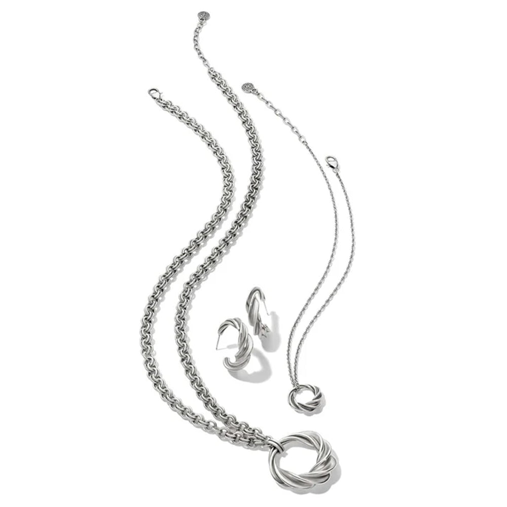 Silver necklace and earrings set on a white background