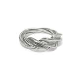 Silver ring with a twisted design on a white background