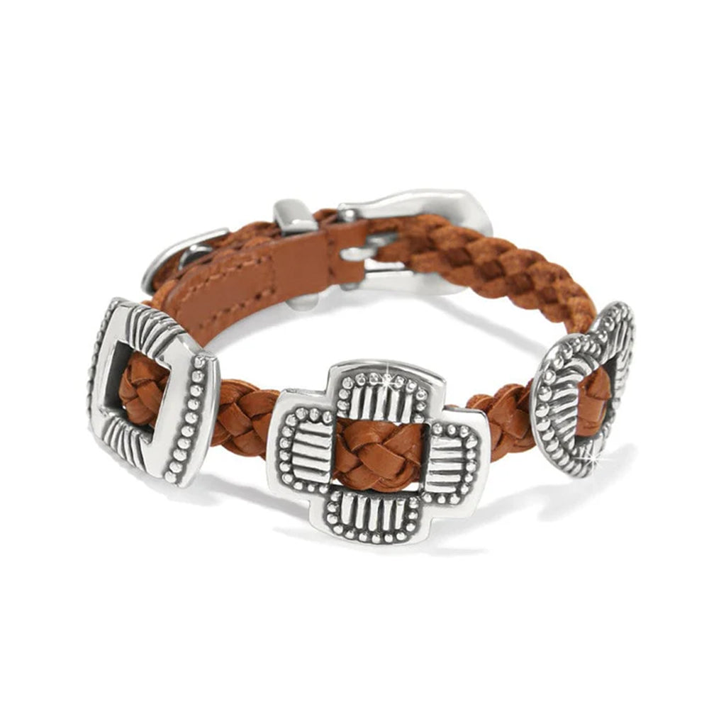 Bracelet with brown leather strap and silver metal clasp on a white background