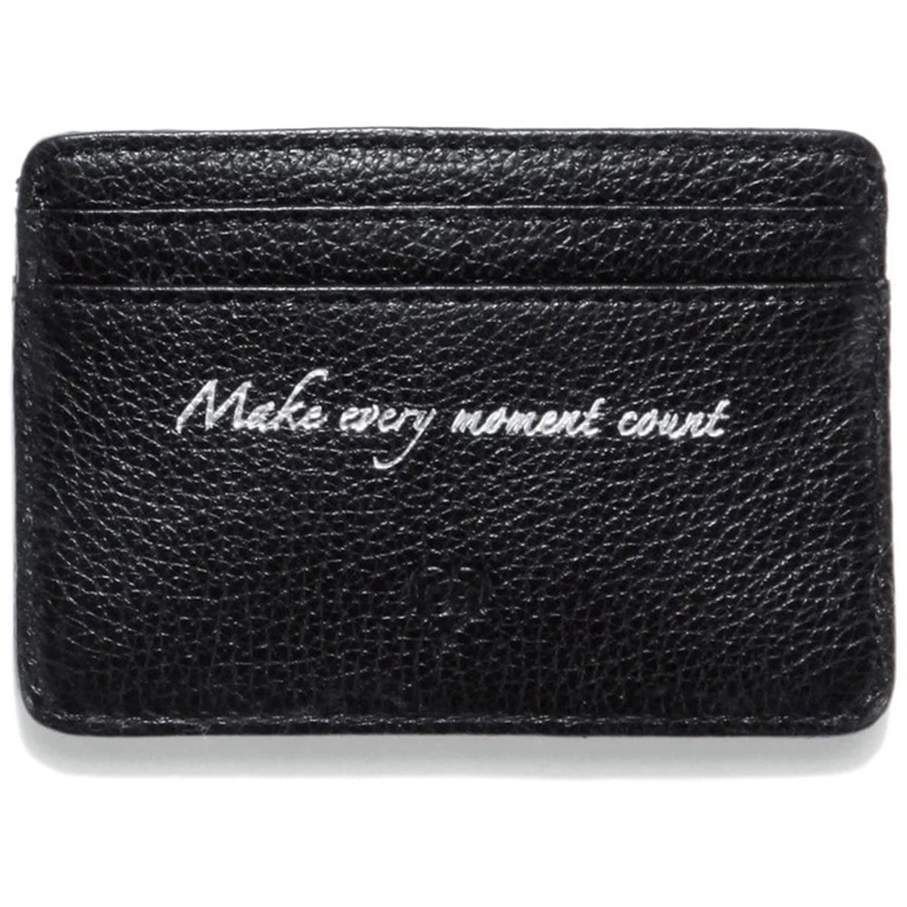 Black leather cardholder with 'Make every moment count' text on a white background