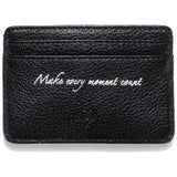 Black leather cardholder with 'Make every moment count' text on a white background