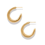 Gold hoop earrings on a white background