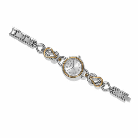 A silver-toned metal bracelet watch with a round silver dial, featuring decorative infinity links accented with gold trim, set against a plain white background.