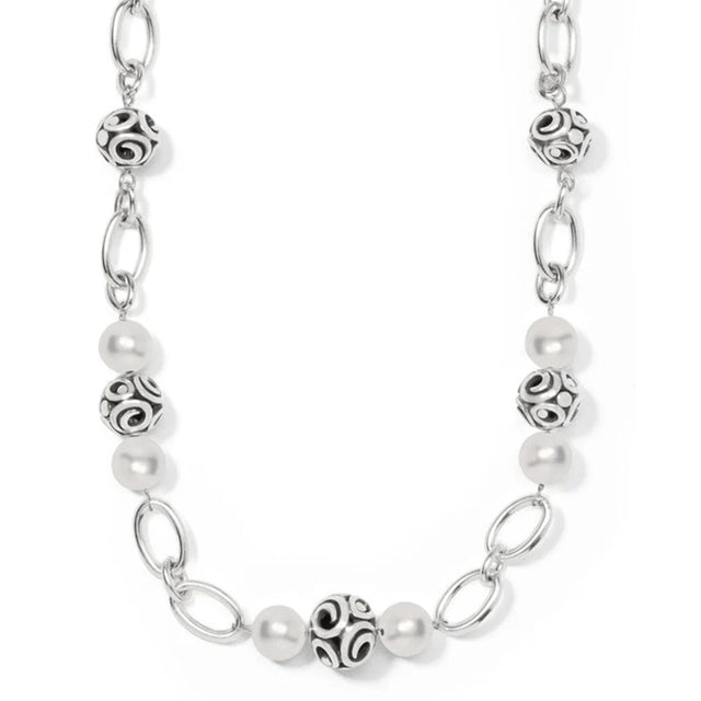 Silver chain necklace with pearl beads on a white background