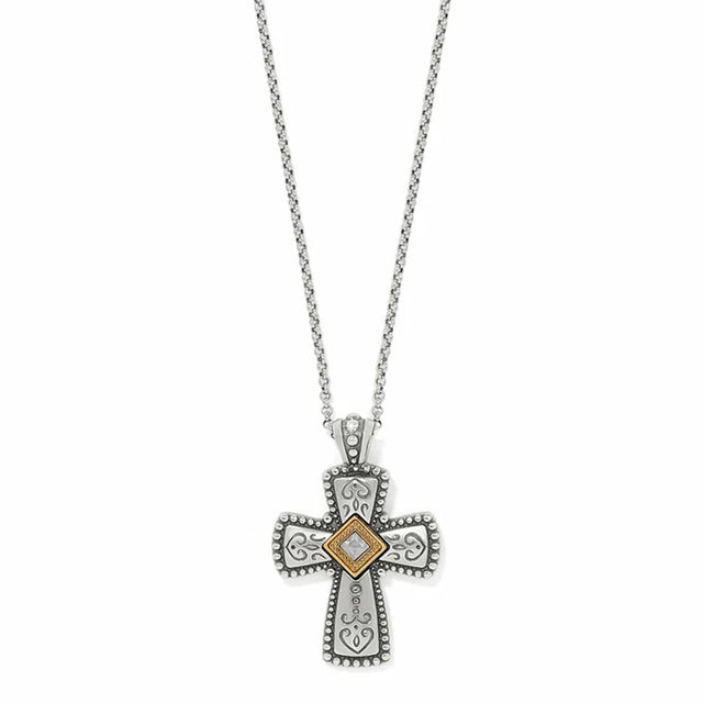 Silver cross pendant necklace with a diamond on a white background