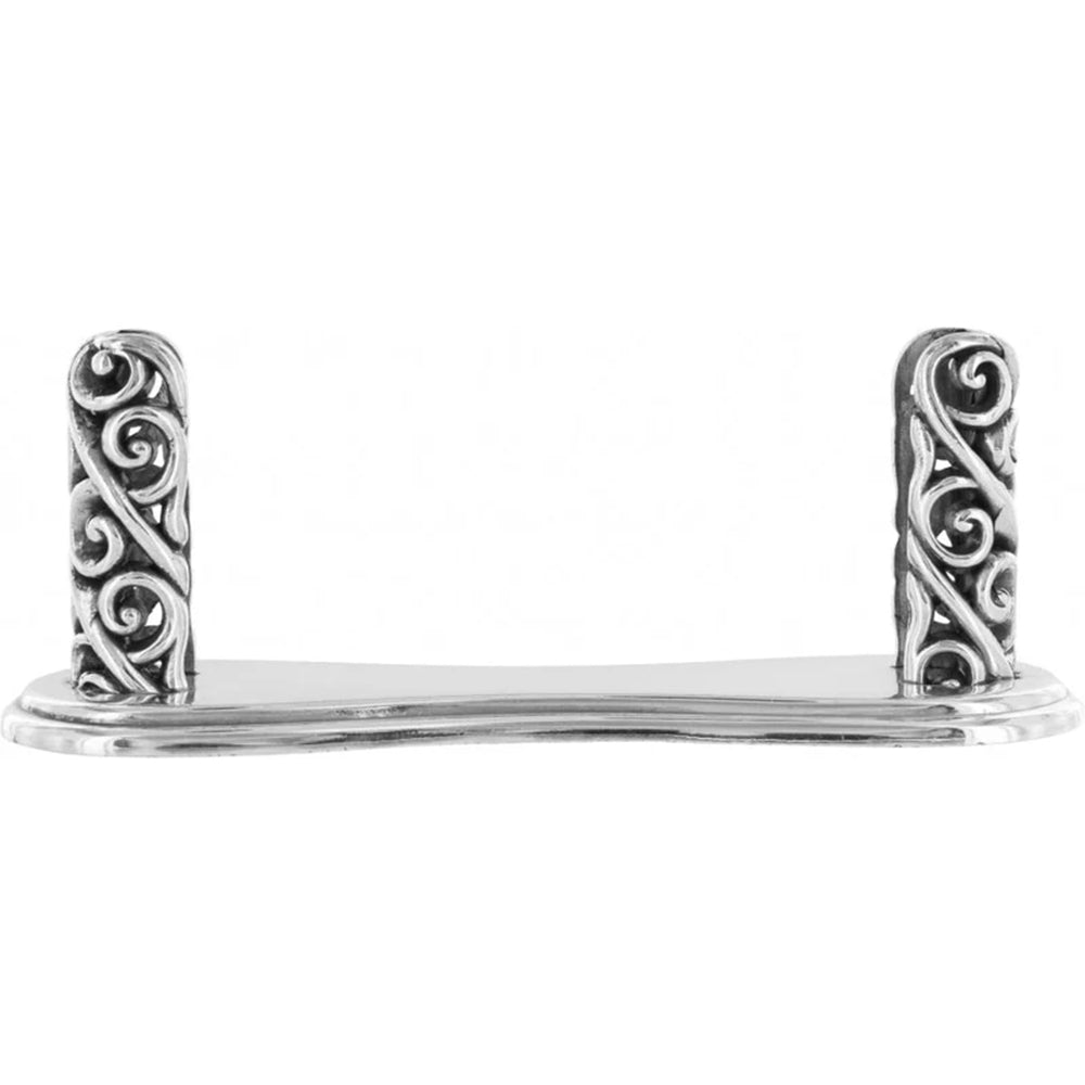 Silver card holder with intricate designs on a white background