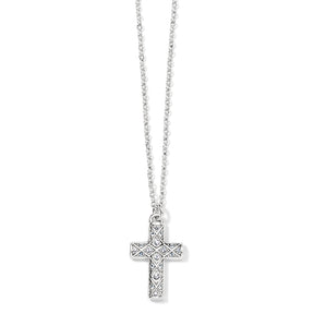 A silver necklace with a diamond cross pendant, the chain is also visible.