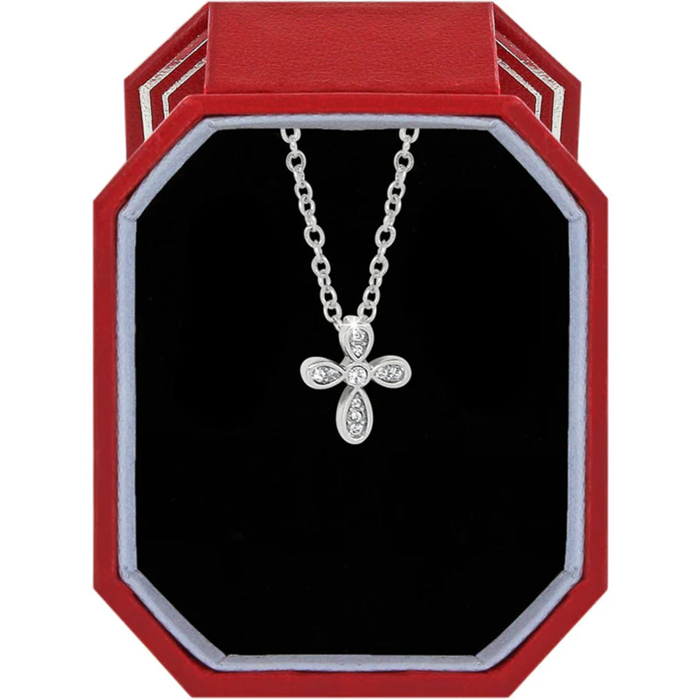 Silver cross necklace in a red and black jewelry box