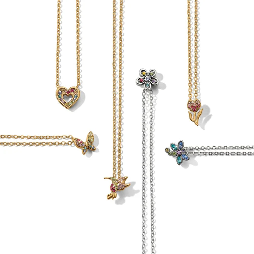 Gold necklaces with various pendants on a white background