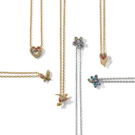 Gold necklaces with various pendants on a white background