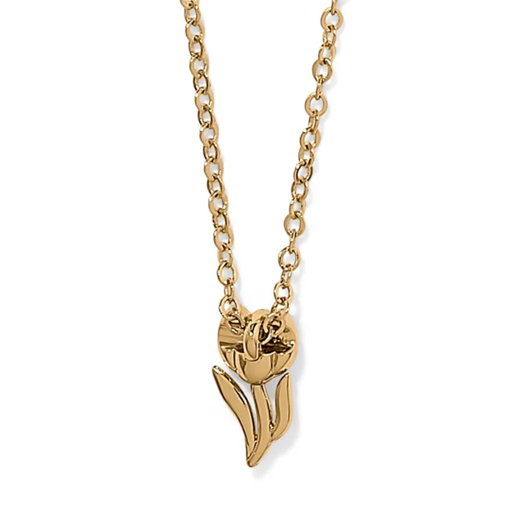 Gold necklace with a tulip-shaped pendant on a white background