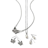 Butterfly-themed jewelry set with necklace, earrings, and pendants on a white background