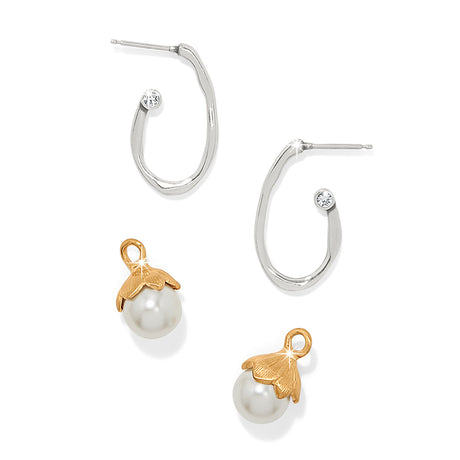 Pair of hoop earrings with pearl charms on a white background