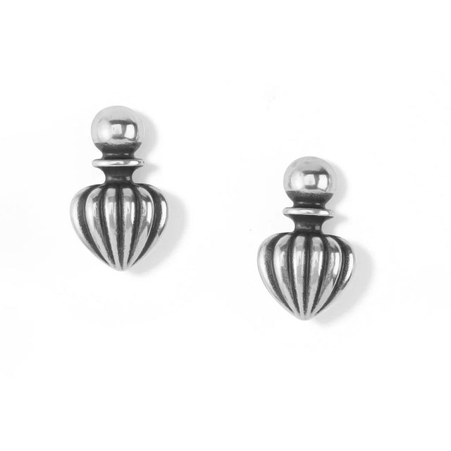 Pair of silver earrings with striped design on a white background